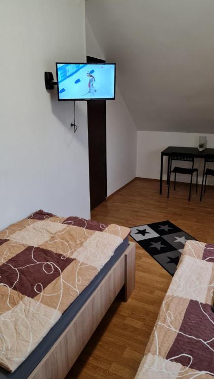 Postel nebo postele na pokoji v ubytování Arató Vendégház