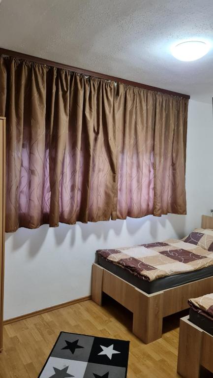 Postel nebo postele na pokoji v ubytování Arató Vendégház