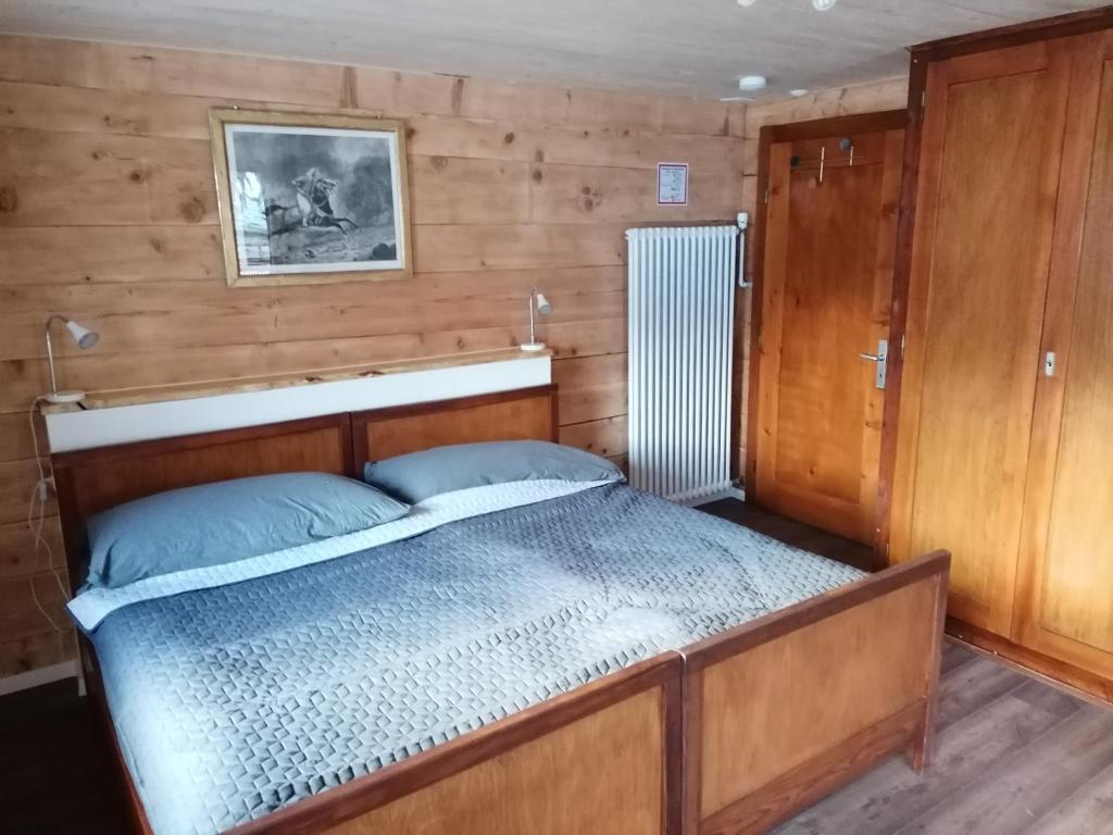 Postel nebo postele na pokoji v ubytování Room's chez BeNi
