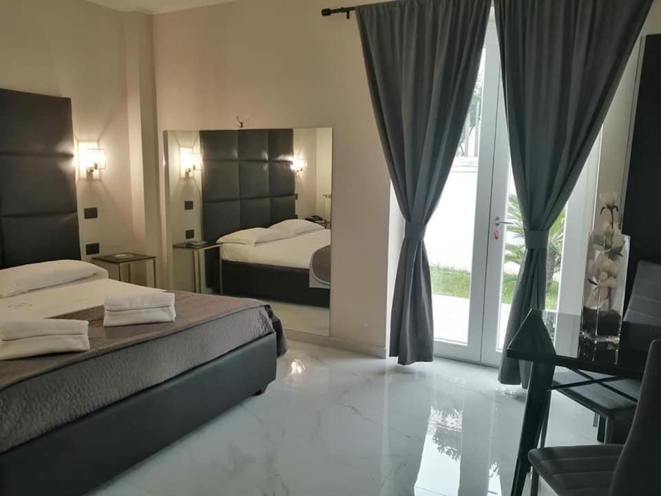 Postel nebo postele na pokoji v ubytování Hotel Elite