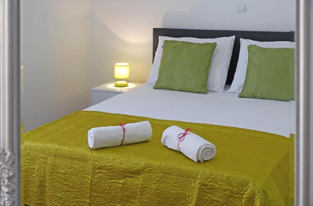 Postel nebo postele na pokoji v ubytování A&M Apartment and Rooms