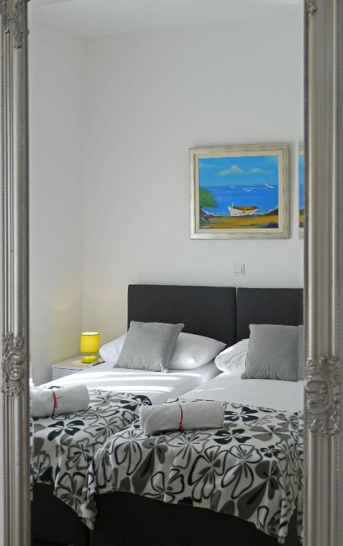 Postel nebo postele na pokoji v ubytování A&M Apartment and Rooms