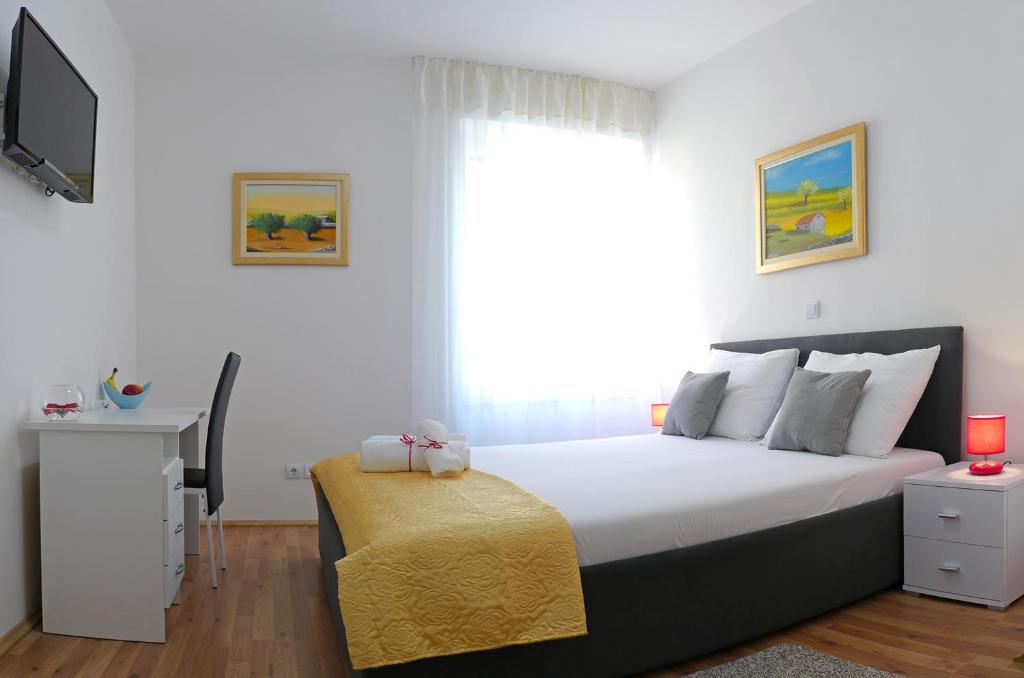 Postel nebo postele na pokoji v ubytování A&M Apartment and Rooms