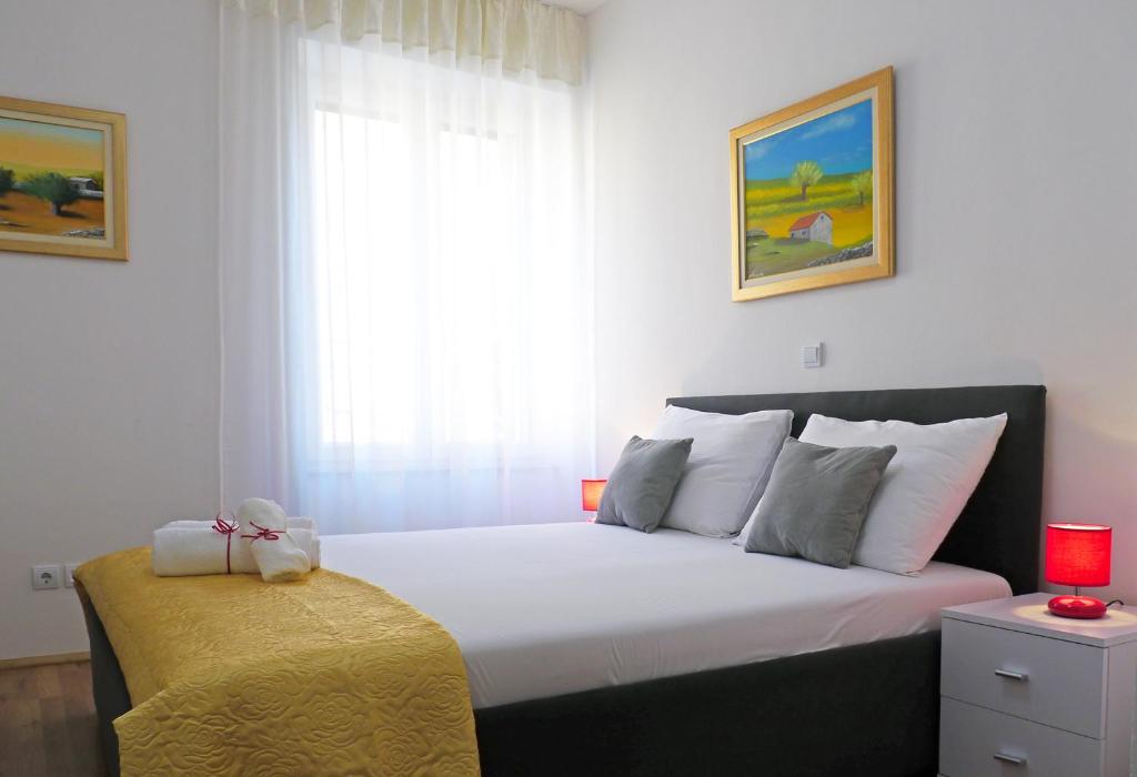 Postel nebo postele na pokoji v ubytování A&M Apartment and Rooms