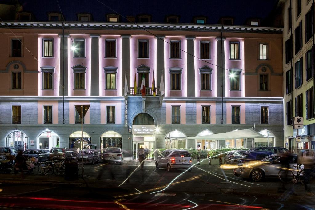 a large building with a clock on the front of it at Arli Hotel Business and Wellness in Bergamo