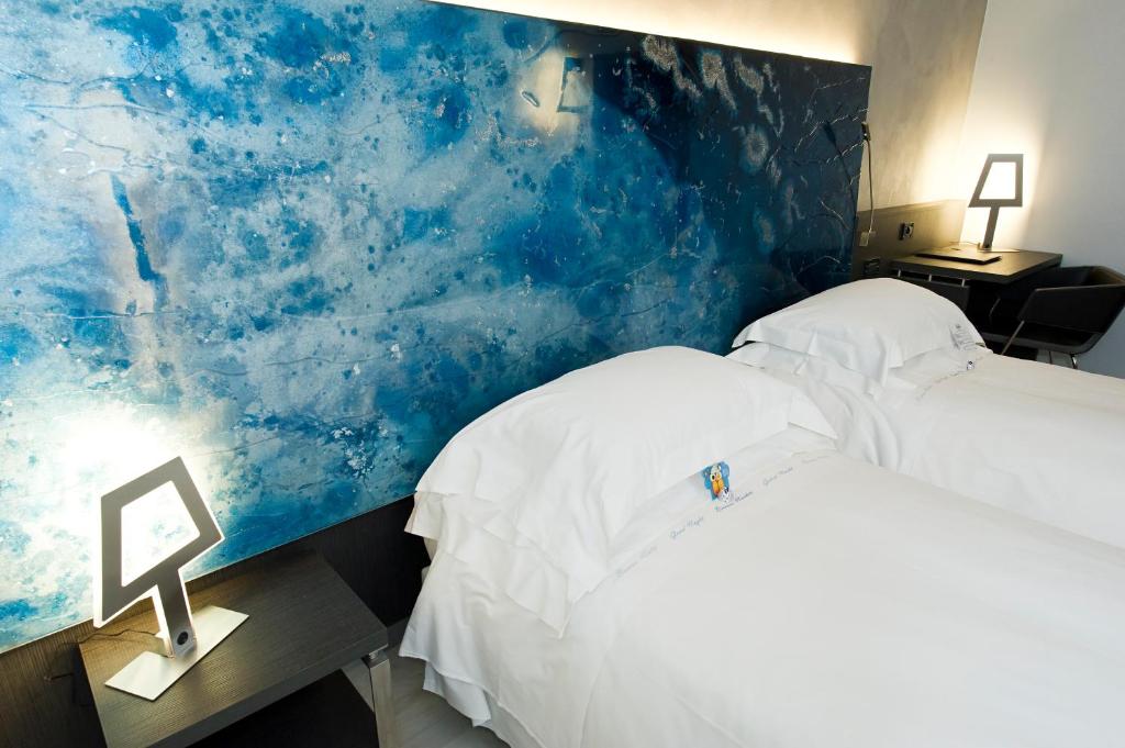 Postel nebo postele na pokoji v ubytování Arli Hotel Business and Wellness