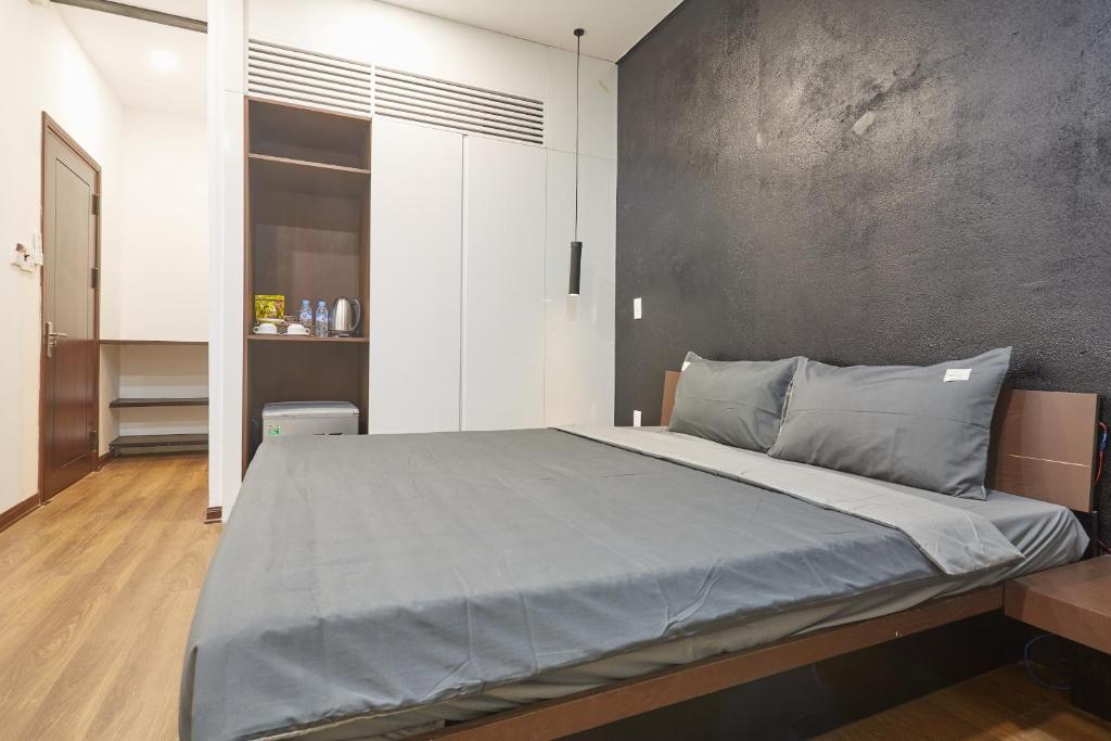 Postel nebo postele na pokoji v ubytování The Garden Capsule Hotel