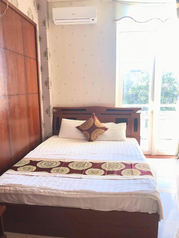 Postel nebo postele na pokoji v ubytování Hoàng Anh hotel