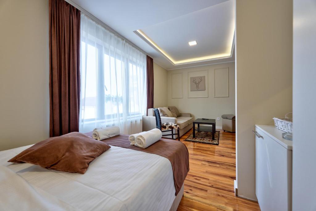 Postel nebo postele na pokoji v ubytování Onix Residence