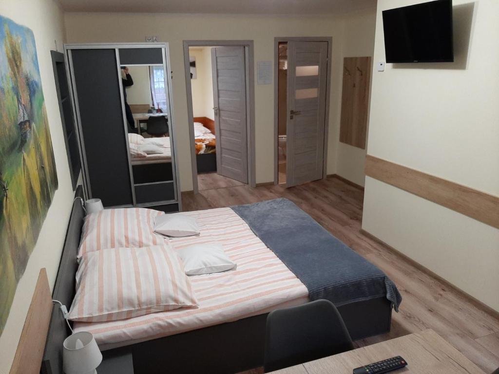 Postel nebo postele na pokoji v ubytování Pokoje Beata