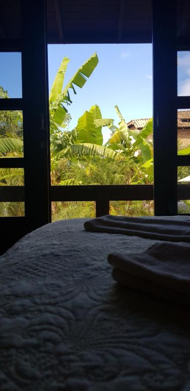 Cama ou camas em um quarto em Pousada Guaruja