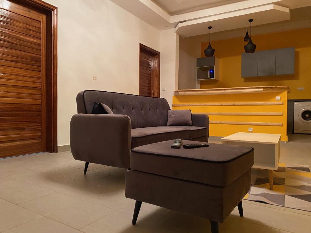 a living room with a couch and a coffee table at Gîte Le Toubé in Saint-Louis