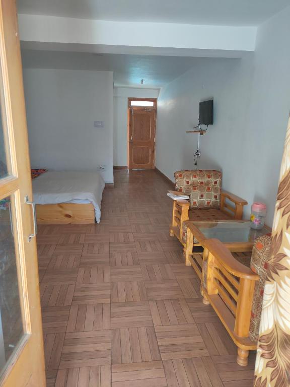 Postel nebo postele na pokoji v ubytování Hotel BHRIGU
