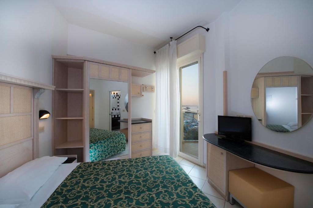 Postel nebo postele na pokoji v ubytování Hotel Prestige