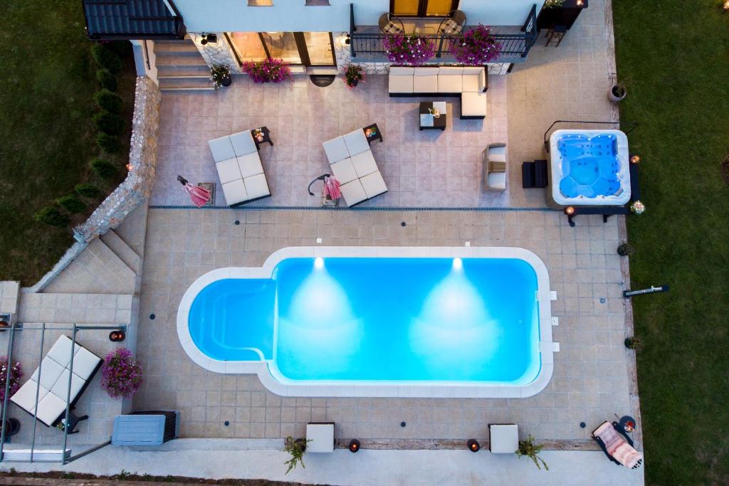an overhead view of a swimming pool at Guest House Plitvice Hills in Korenica