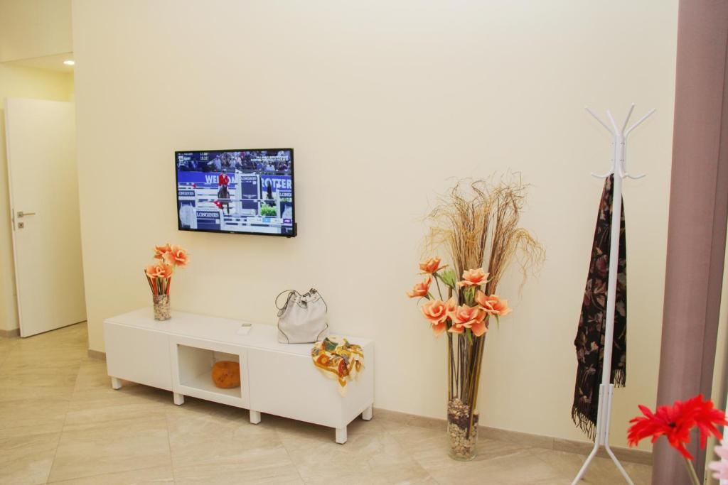 Televízia a/alebo spoločenská miestnosť v ubytovaní DOMUS DIVI - appartamento nel cuore di Roma
