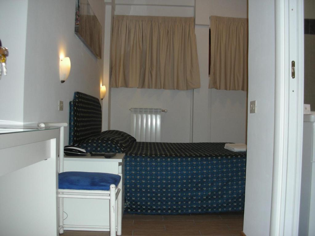 En eller flere senger på et rom på Residence Balduina