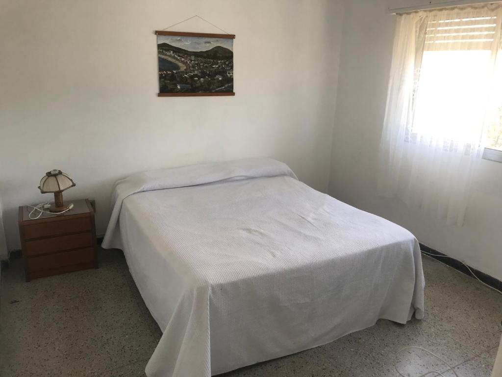 En eller flere senge i et værelse på Piriapolis apartamento