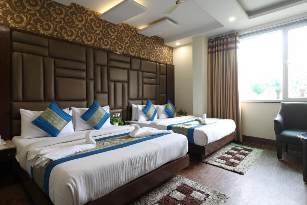 Cama o camas de una habitación en Hotel Mannat international by Mannat
