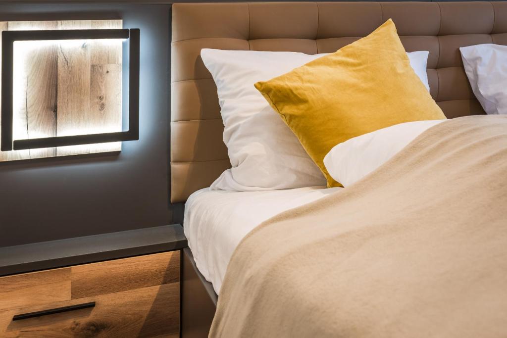 Säng eller sängar i ett rum på Arbio I Cozy Apartments Augsburg-Lechhausen