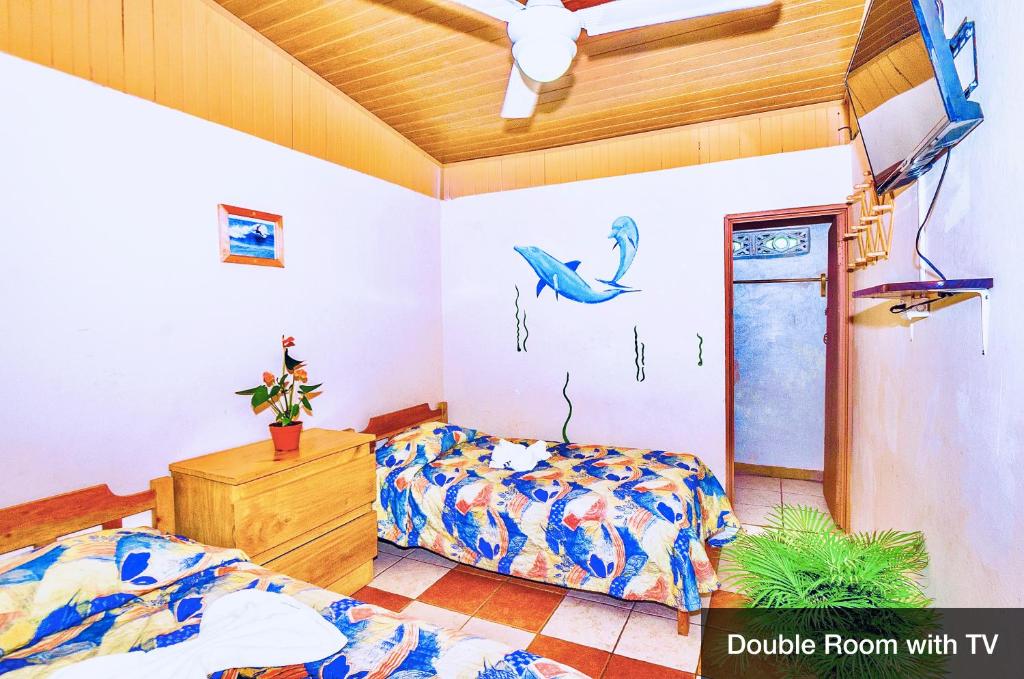 Postel nebo postele na pokoji v ubytování Blue Iguana