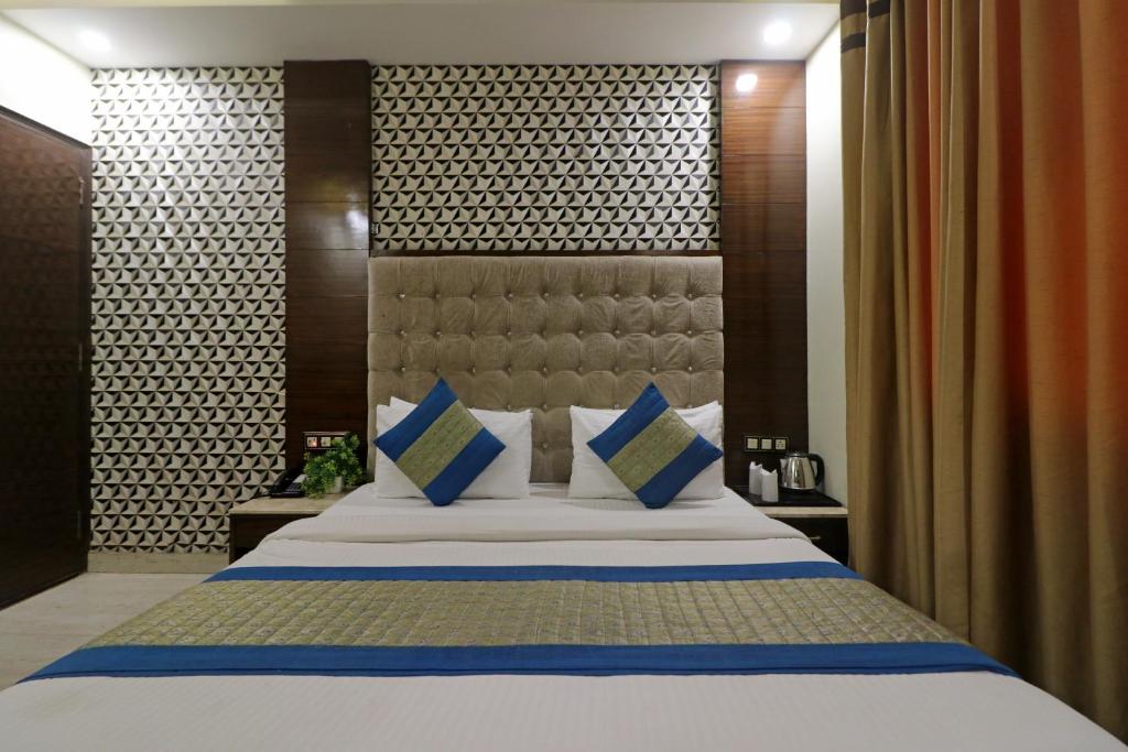 Cama o camas de una habitación en Hotel Mannat international by Mannat