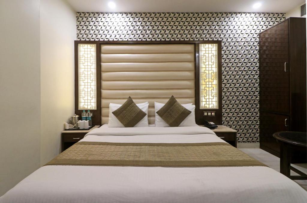 Cama o camas de una habitación en Hotel Mannat international by Mannat