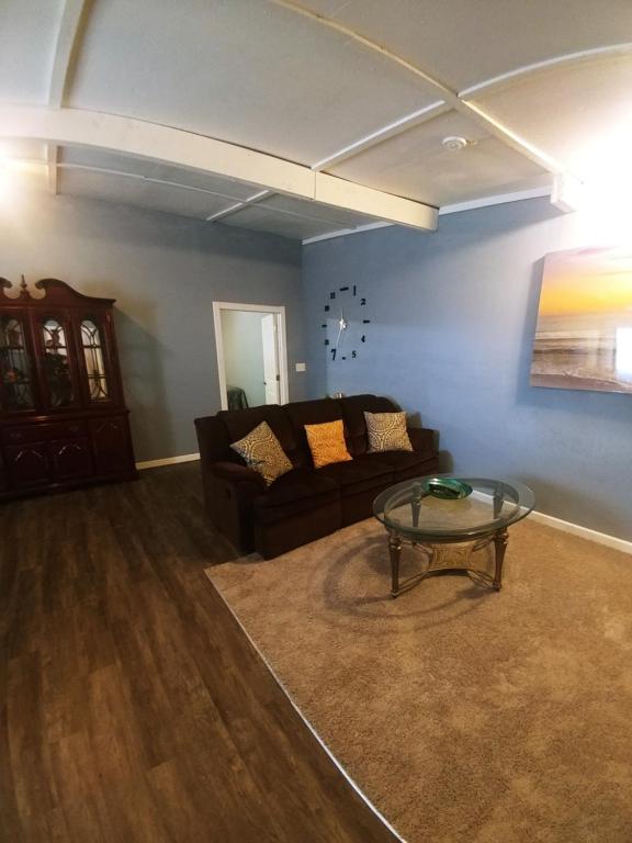 a living room with a couch and a glass table at Dolan Springs, Grand Canyon Skywalk in Dolan Springs