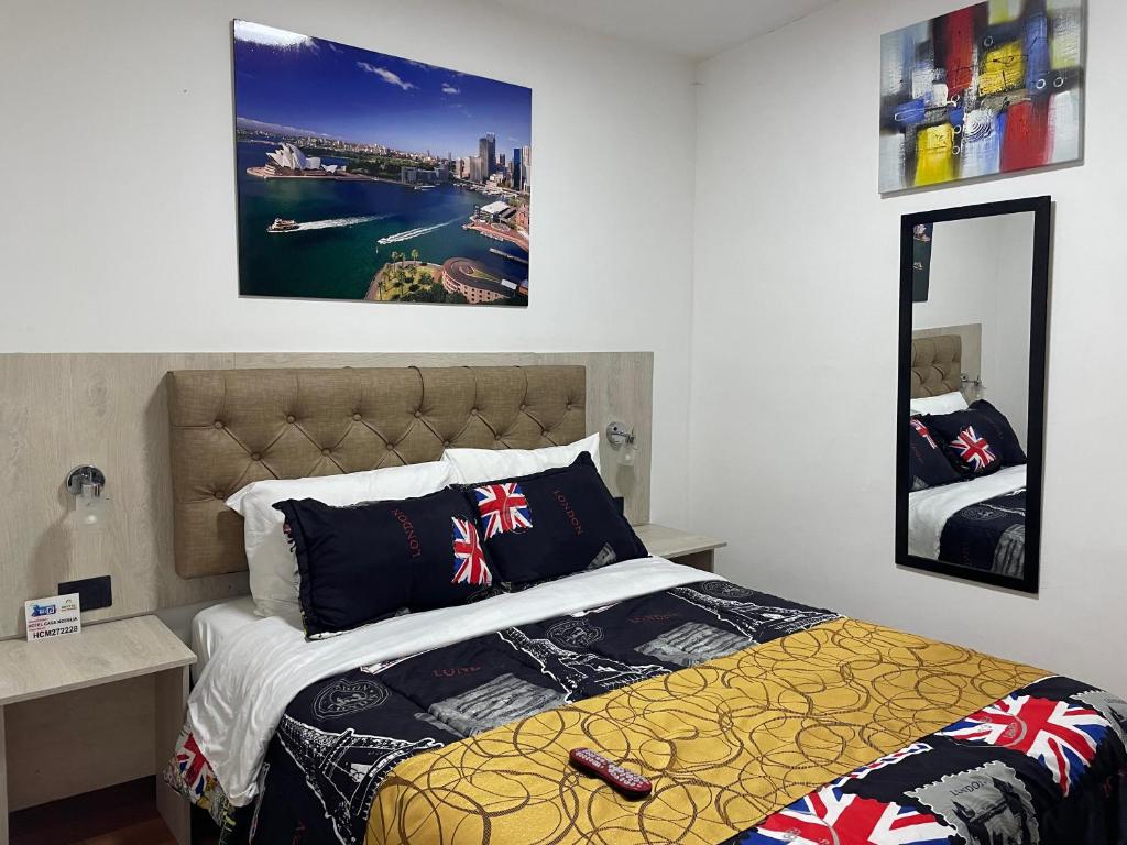 Postel nebo postele na pokoji v ubytování Hotel Casa Modelia