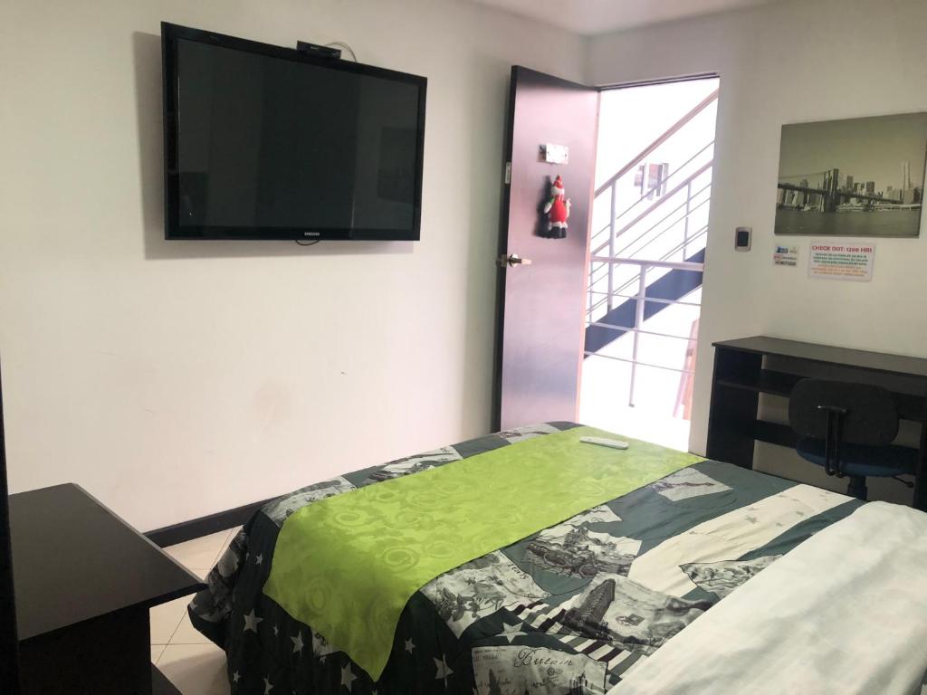 Postel nebo postele na pokoji v ubytování Hotel Casa Modelia