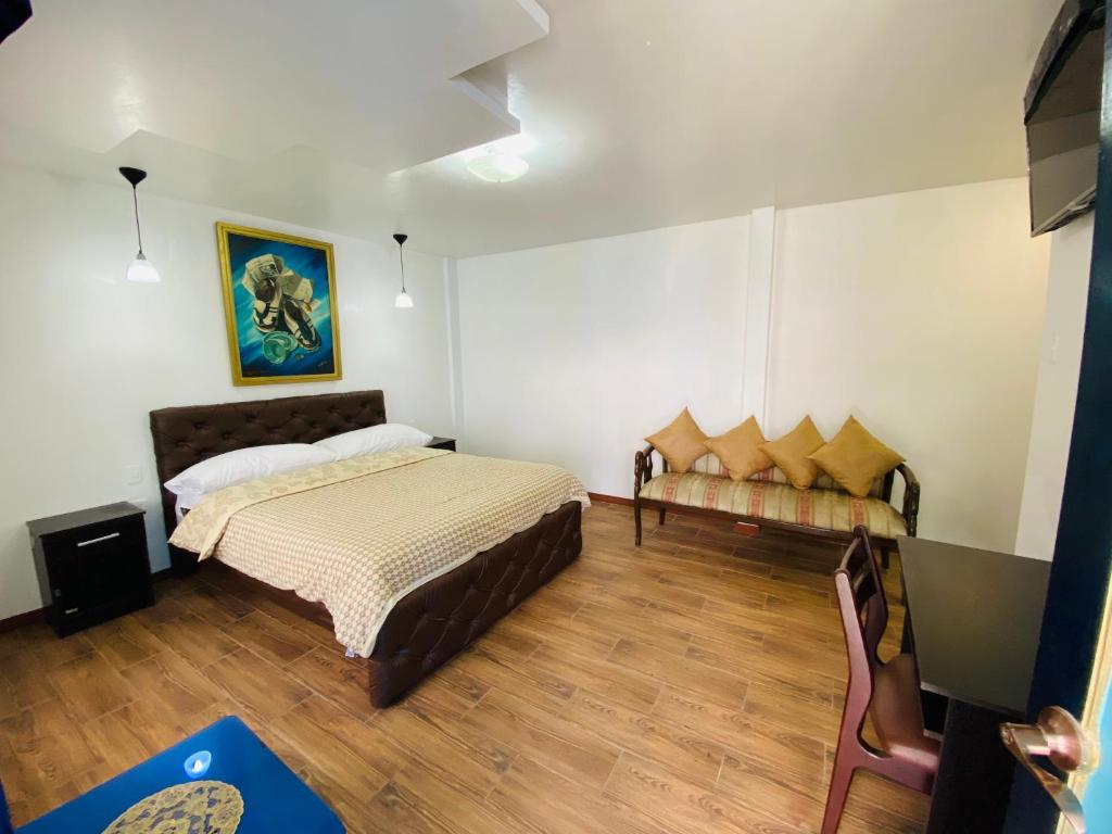 Postel nebo postele na pokoji v ubytování Hotel Montecarlo