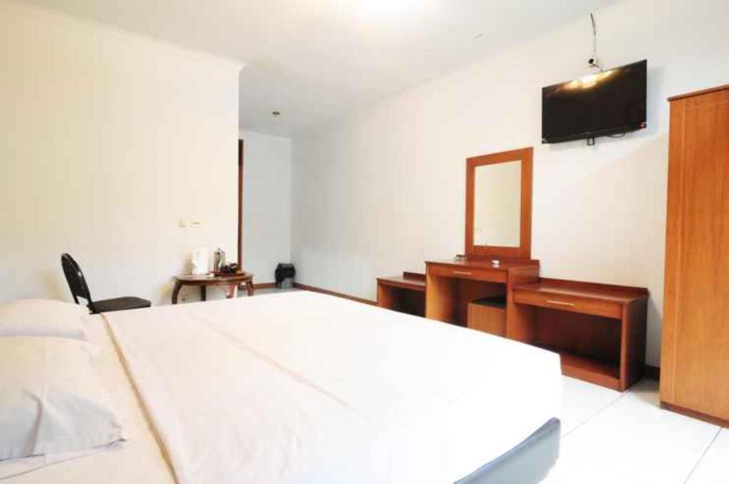 Voodi või voodid majutusasutuse De'Qur Hotel Bandung toas