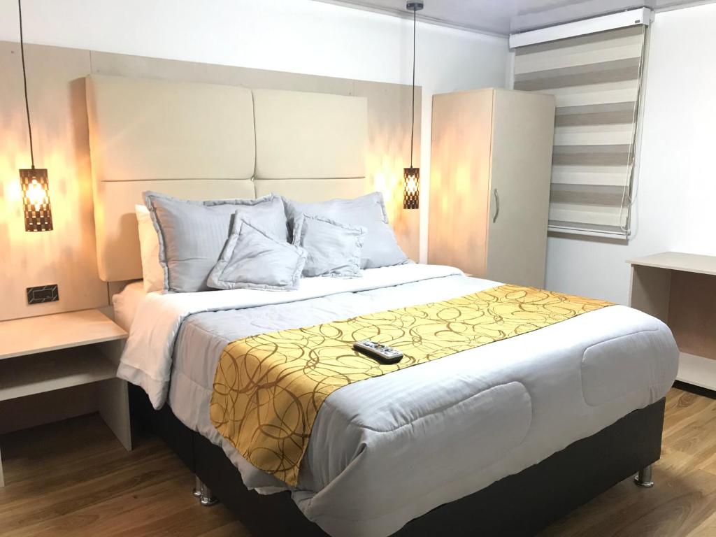 Postel nebo postele na pokoji v ubytování Hotel Casa Modelia