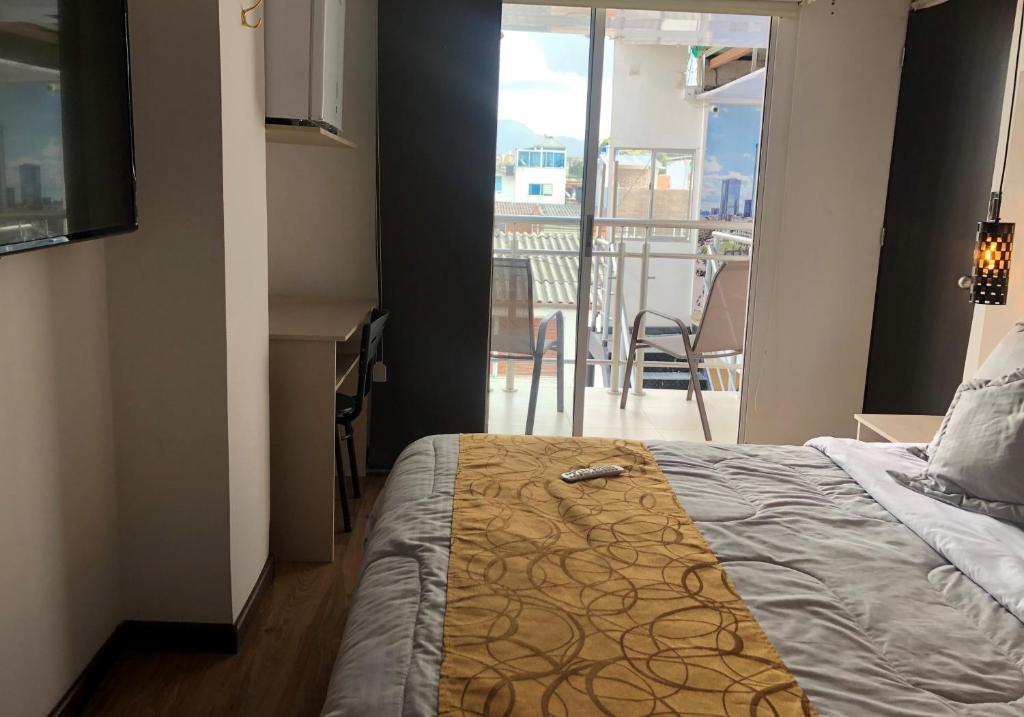 Postel nebo postele na pokoji v ubytování Hotel Casa Modelia