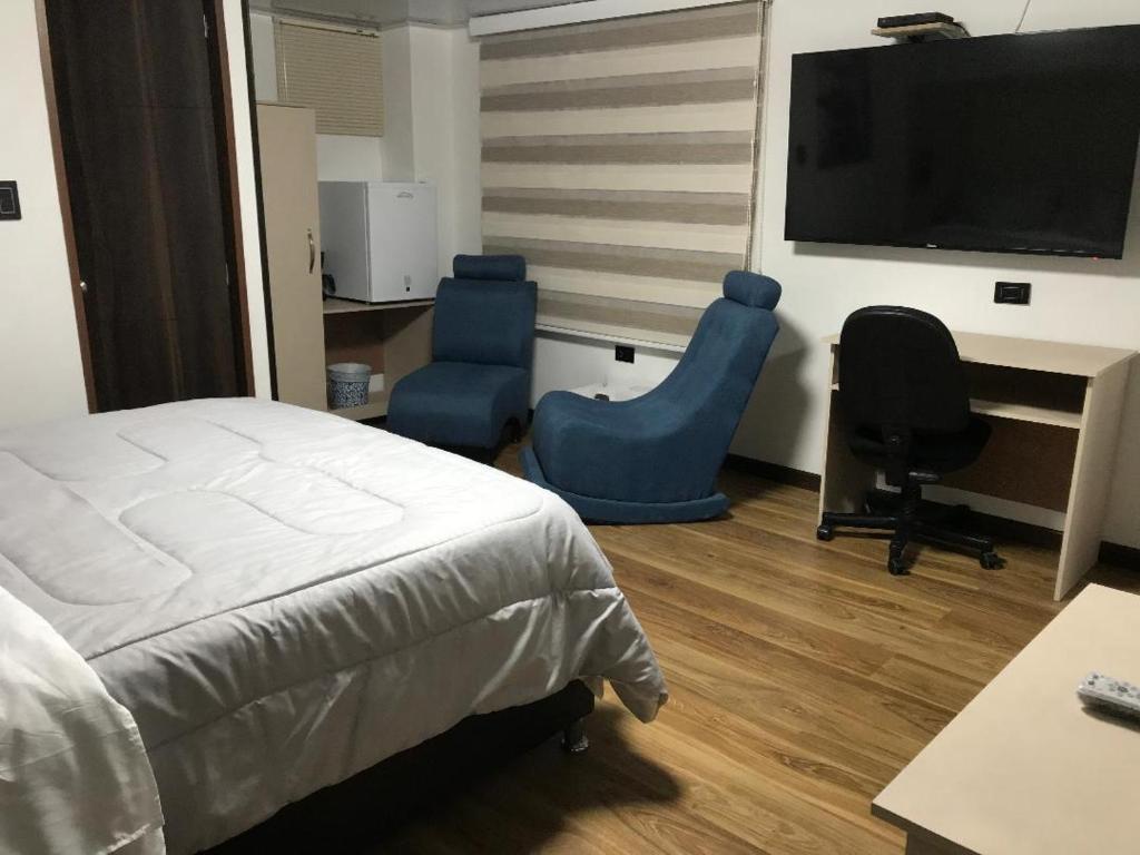 TV a/nebo společenská místnost v ubytování Hotel Casa Modelia