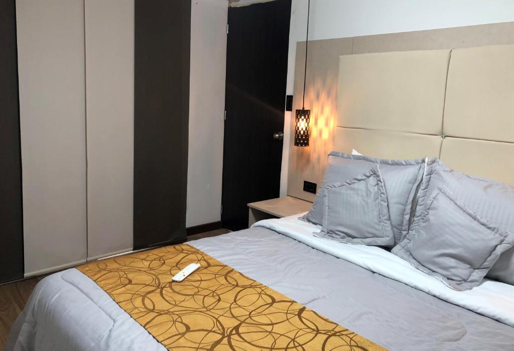 Postel nebo postele na pokoji v ubytování Hotel Casa Modelia