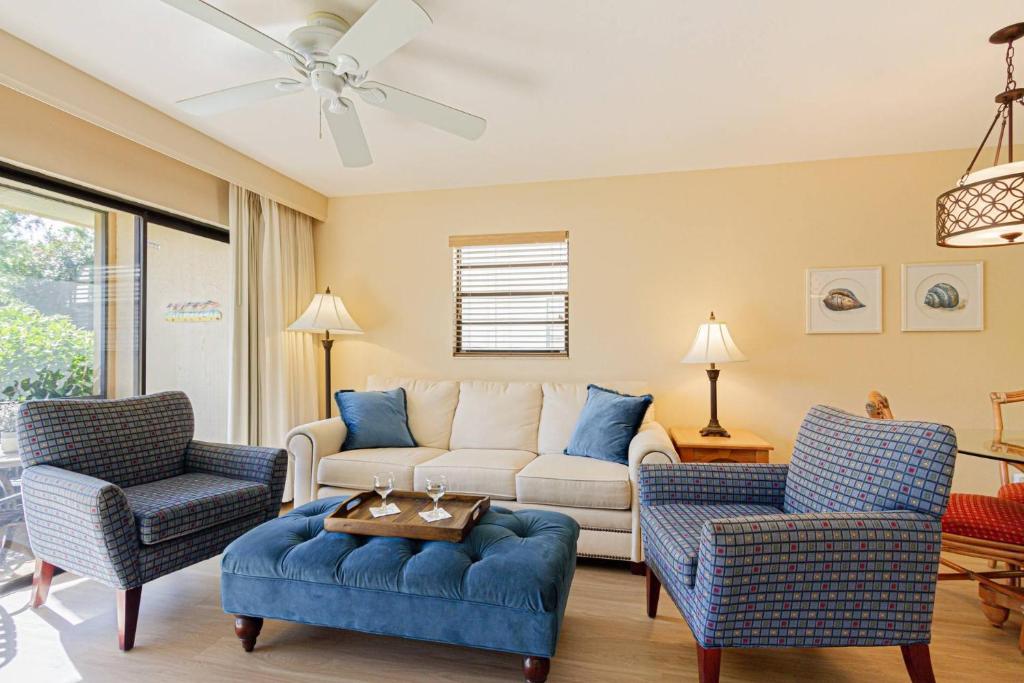 a living room with a couch and two chairs at Park Shore Resort, 1st Floor, Bldg.I, End Unit in Naples