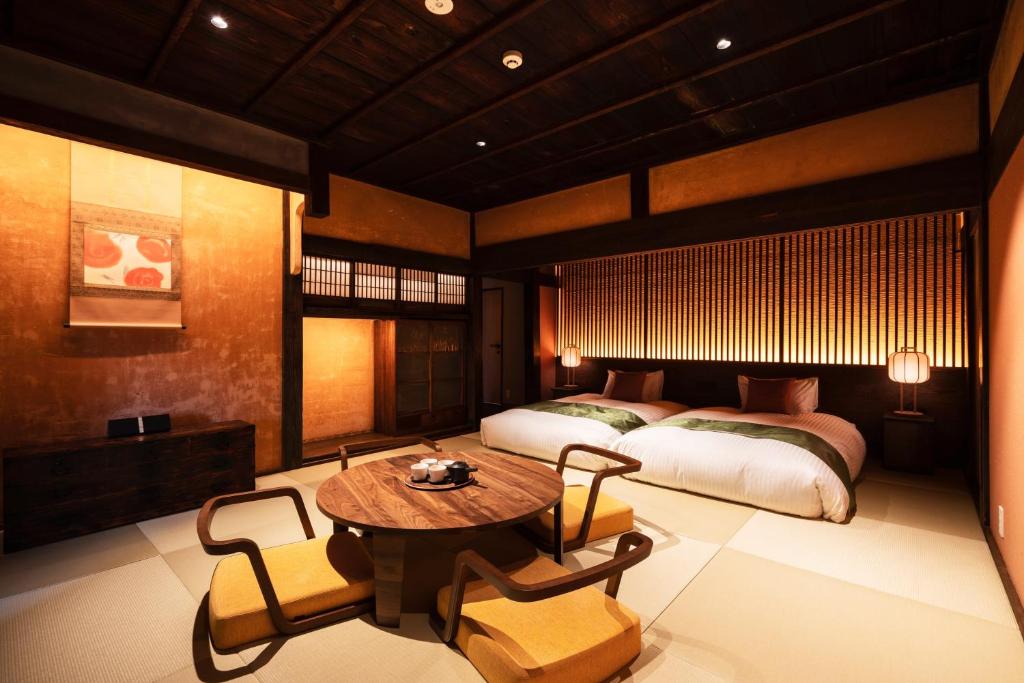 Postel nebo postele na pokoji v ubytování Nazuna Obi Onsen Resort
