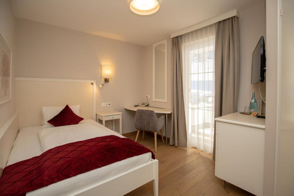 Posteľ alebo postele v izbe v ubytovaní The Hotel - himmlisch wohlfühlen