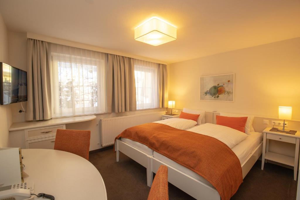 Posteľ alebo postele v izbe v ubytovaní The Hotel - himmlisch wohlfühlen