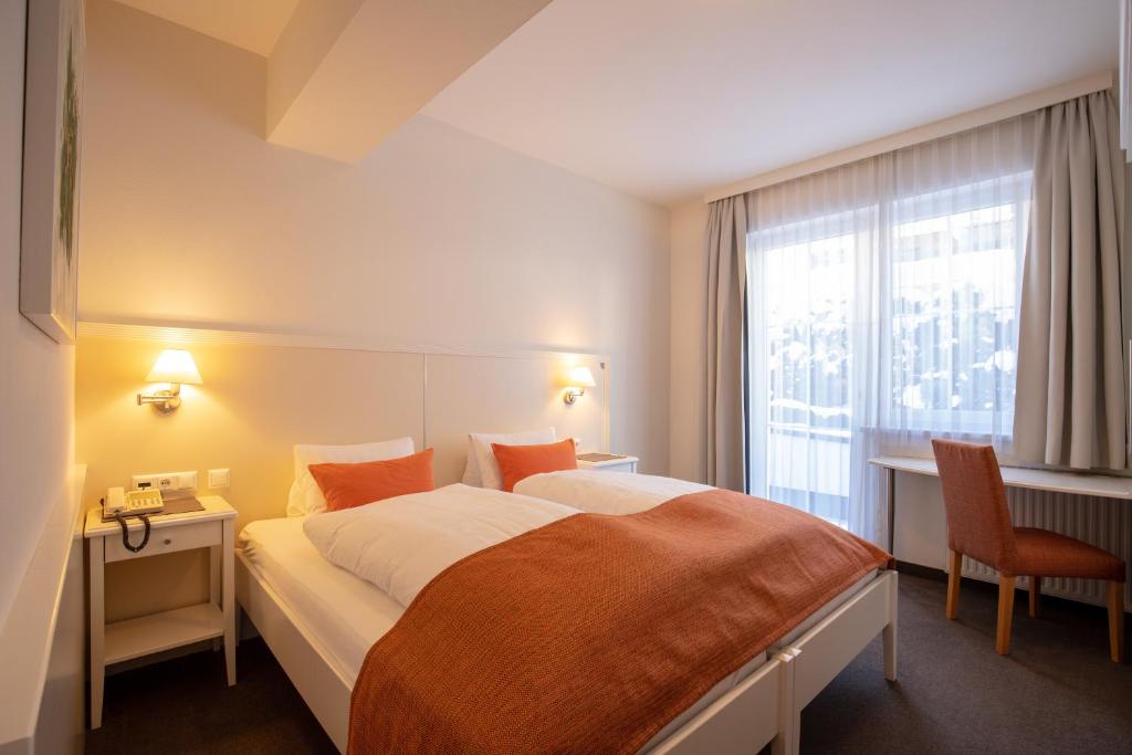 Posteľ alebo postele v izbe v ubytovaní The Hotel - himmlisch wohlfühlen