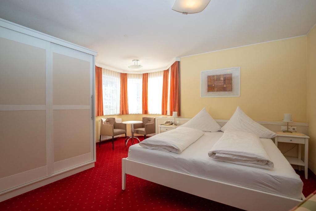 Posteľ alebo postele v izbe v ubytovaní The Hotel - himmlisch wohlfühlen