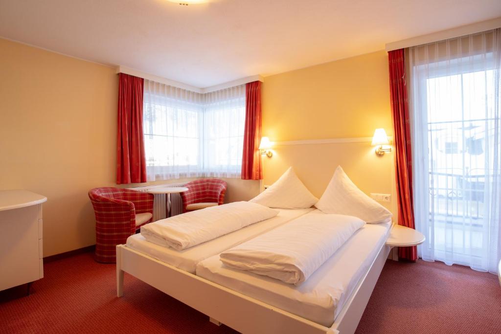 Posteľ alebo postele v izbe v ubytovaní The Hotel - himmlisch wohlfühlen