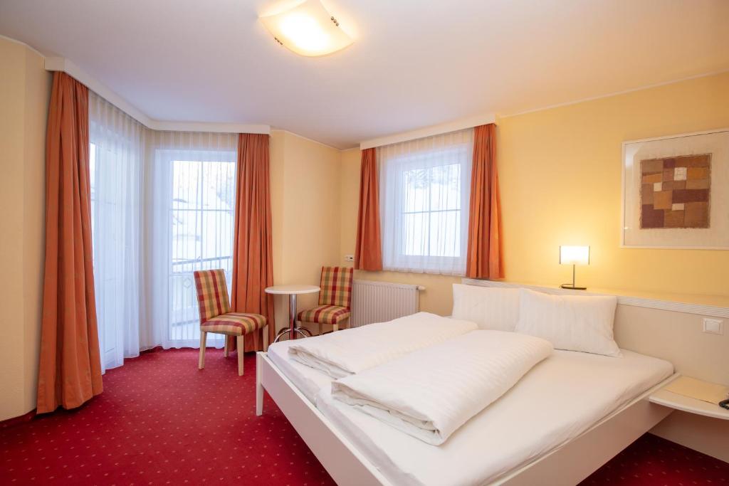 Posteľ alebo postele v izbe v ubytovaní The Hotel - himmlisch wohlfühlen