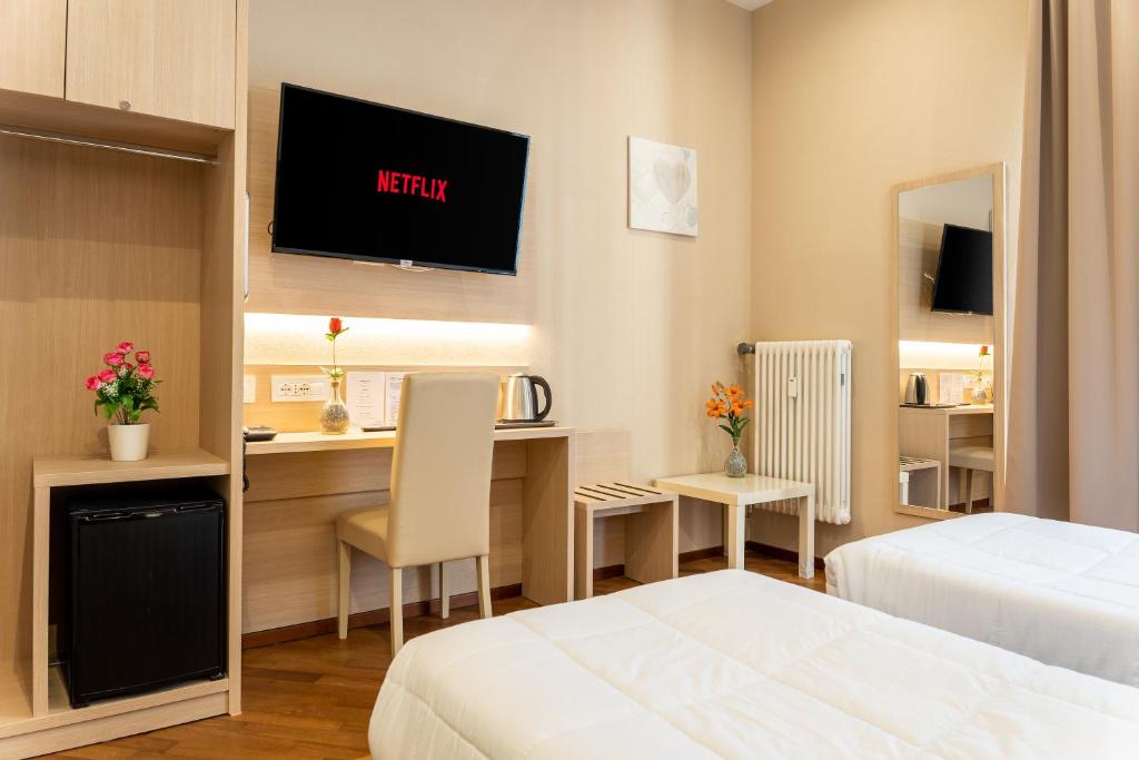 Postel nebo postele na pokoji v ubytování Hotel Victoria