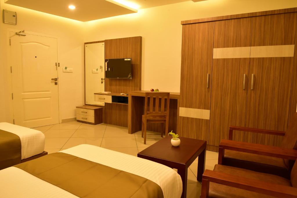 TV a/nebo společenská místnost v ubytování WHITE SUITE HOTEL
