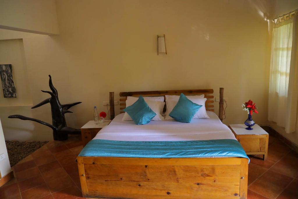 Postel nebo postele na pokoji v ubytování Pranavam Resort & Spa