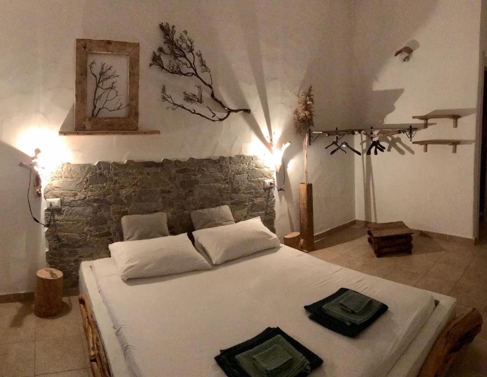 Postel nebo postele na pokoji v ubytování I Ginepri