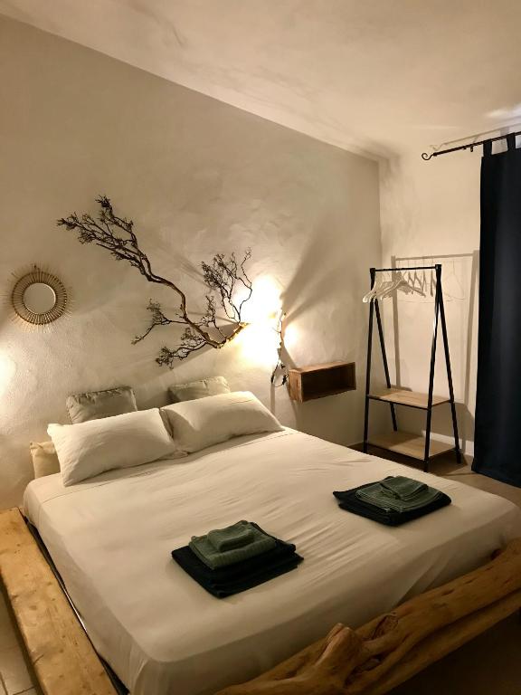 Postel nebo postele na pokoji v ubytování I Ginepri