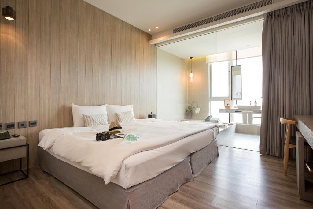 Voodi või voodid majutusasutuse Hotel Day Plus Teascape toas